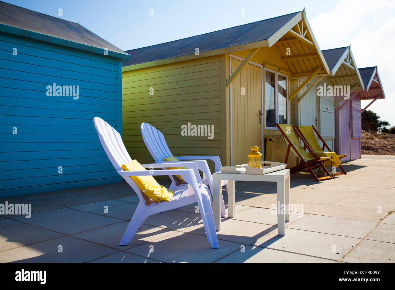 Wooden seaside beach chalets, with tables & chairs in Fleetwood