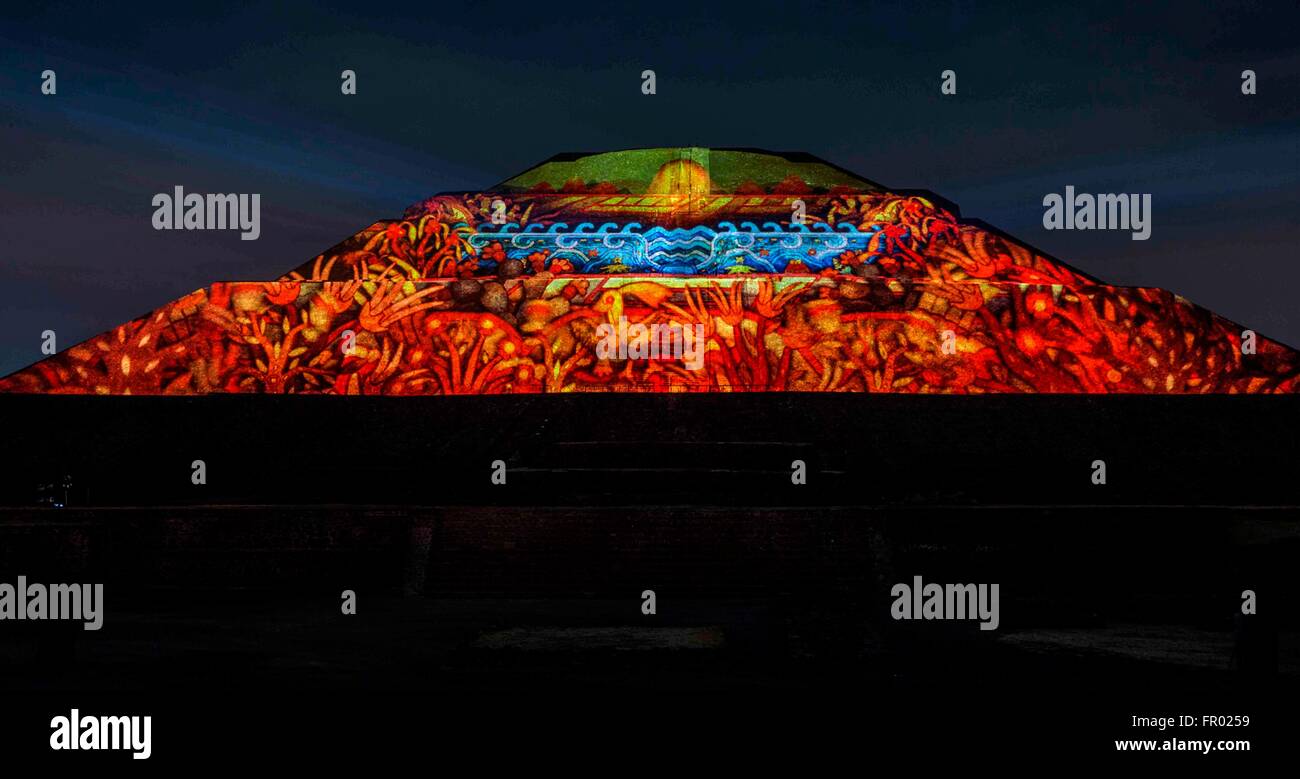 Mexico City, Mexico. 20th Mar, 2016. The pyramid of the Sun & Moon at the Teotihuacan archeological site is lit during the first light and sound show ever presented at the World Heritage site known as The City of the Gods March 19, 2016 in Mexico City, Mexico. Mexican President Enrique Pena Nieto inaugurated the event which is expected to attract more visitors to the cultural attraction. Stock Photo