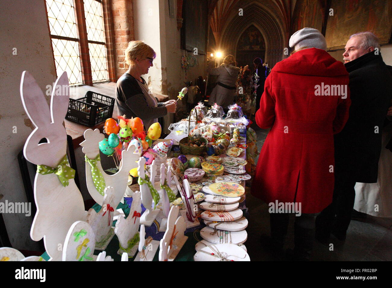 Pelplin, Poland 20th, March 2016 People attend the Easter market during the Palm Sunday in the Cistercian monastery in Peplin. Visitors can buy traditional Easter eggs,butter  lambs, cakes, Easter palms and other traditional Easter products. Credit:  Michal Fludra/Alamy Live News Stock Photo