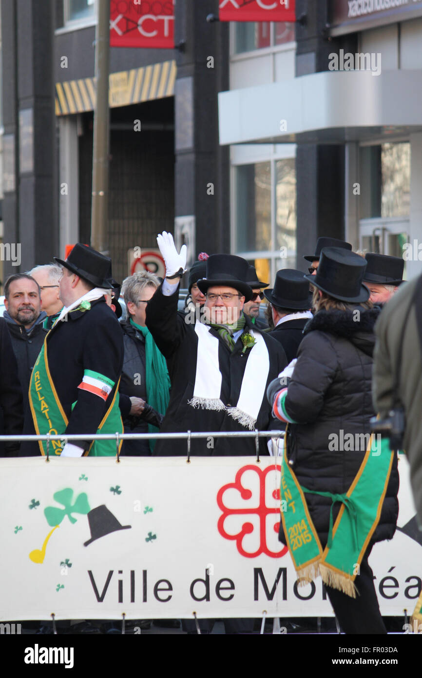 Montreal, Canada. 20th March, 2016. Montreal mayor Denis Coderre (in the middle) walking on St. Patrick’s Day Parade. - Stock Image