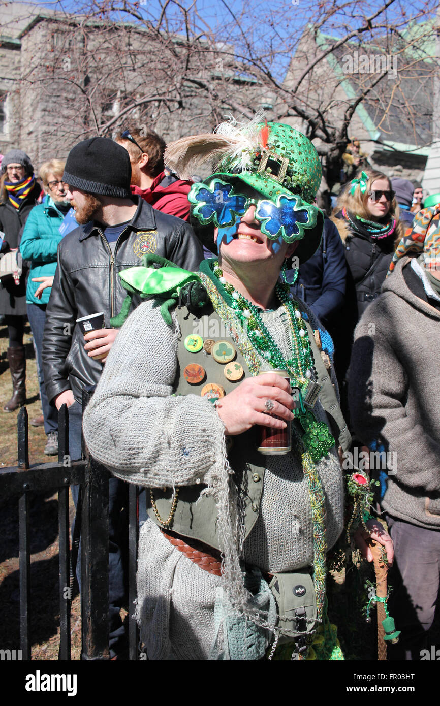 Montreal, Canada. 20th March, 2016. A man watching St. Patrick’s Day Parade. Credit:  Ali Alshammasi/Alamy Live - Stock Image