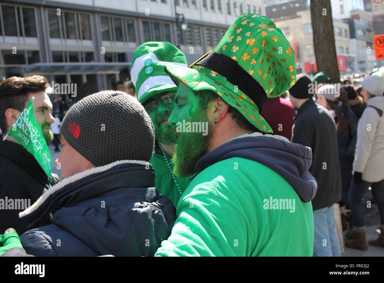 Montreal, Canada. 20th March, 2016. A man with painted green face watching St. Patrick’s Day Parade. Credit:  Ali - Stock Image