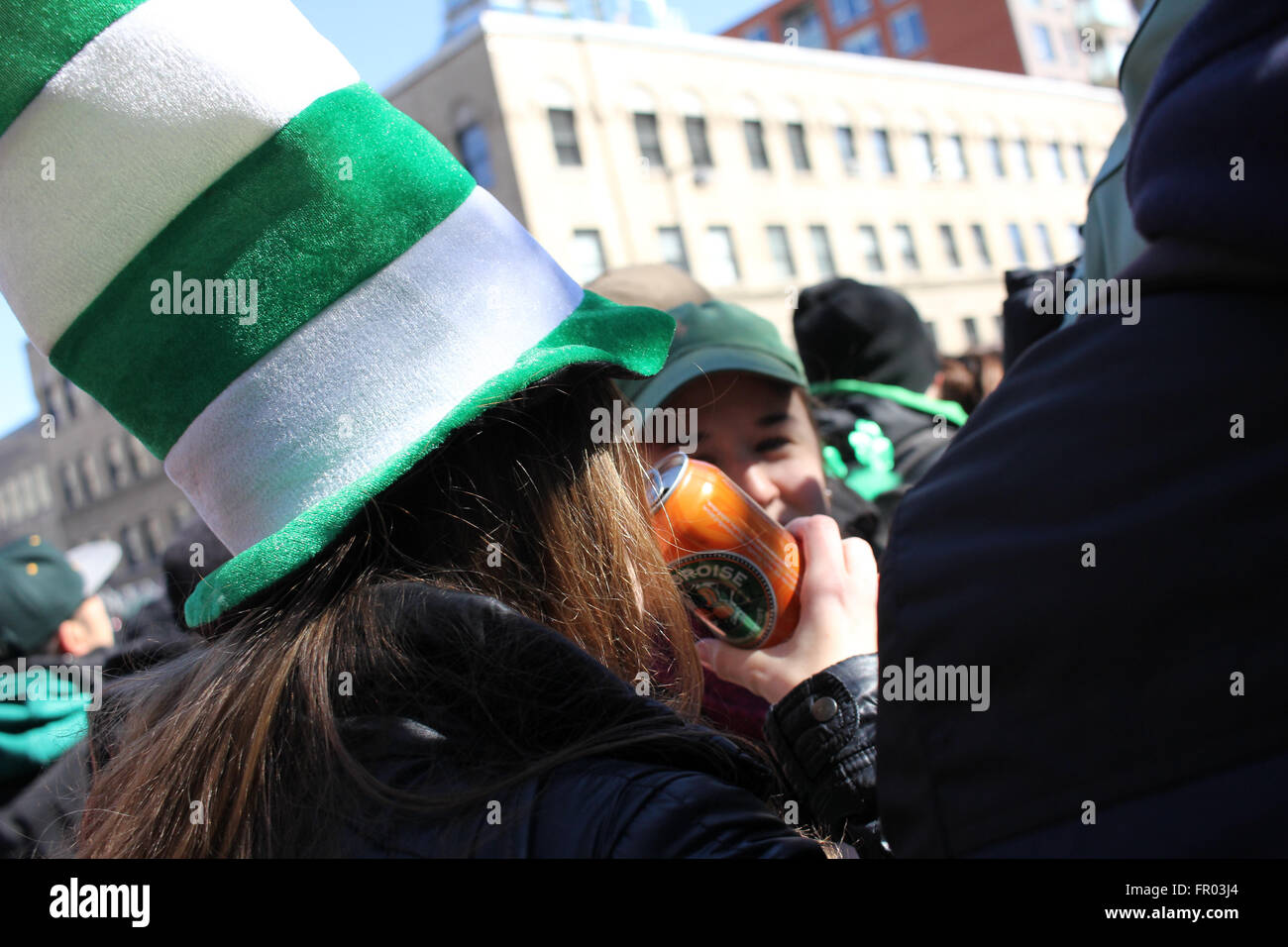 Montreal, Canada. 20th March, 2016. Crowd on the side of the street watching St. Patrick’s Day Parade. Credit:  - Stock Image