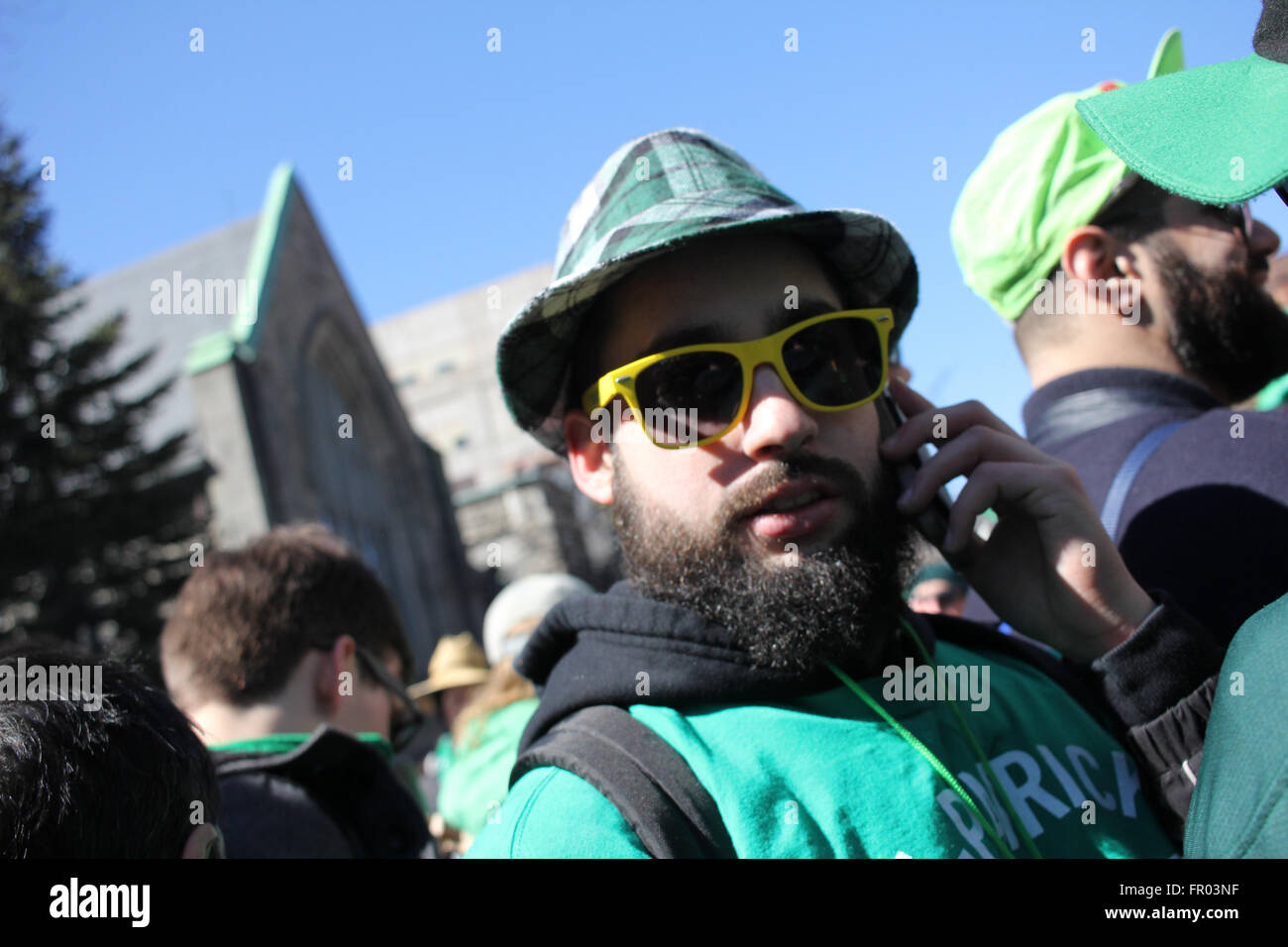 Montreal, Canada. 20th March, 2016. A man watching St. Patrick’s Day Parade. Credit:  Ali Alshammasi/Alamy Live - Stock Image