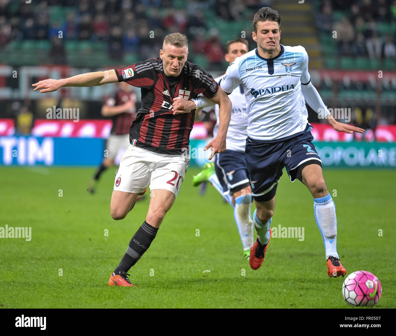 Milan, Italy. 20 mar, 2016: Ignazio Abate (left) and Wasley Hoedt compete for the ball  during the Serie A football match between AC Milan and SS Lazio at Giuseppe Meazza Stadium in Milan, Italy. Credit:  Nicolò Campo/Alamy Live News Stock Photo