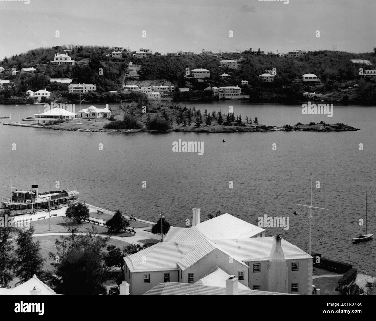 Nov 24, 1953 - Albuoy's Point, Hamilton, Bermuda - On this point of land, members of various youth organizations will assemble to hear an address by Her Majesty Queen Elizabeth II during her visit with his Royal Highness the Duke of Edinburgh. The building in the right foreground is the Royal Bermuda Yacht Club which will be honored by a visit by the Royal Couple where the Queen will sign the guest book. The yacht Wilhelmina which will take the Royal Party on a cruise through the islands of the Great Sound before they disembark at Mangrove Bay Wharf, in the Western section of the islands, pict Stock Photo