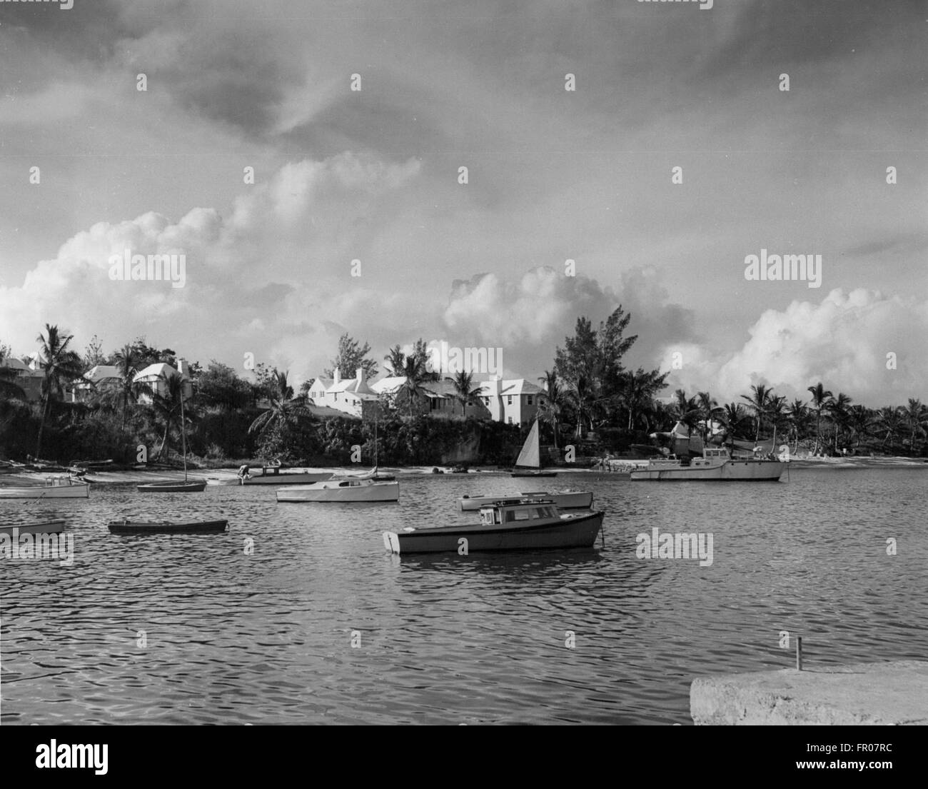 Mangrove Bay, Bermuda. 23rd Nov, 1953. This is the view from Mangrove Bay Wharf which Her Majesty Queen Elizabeth and His Royal Highness the Duke of Edinburgh will have after they disembark from the yacht 'Wilhelmina' at the conclusion of a cruise through the islands of Bermuda's Great Sound. In the background can be seen well-known Cambridge Beaches, a fashionable cottage colony. After a brief drive through the village of Somerset the Royal Couple will return by motor by Government House to attend a garden party held in their honor. © KEYSTONE Pictures/ZUMAPRESS.com/Alamy Live News Stock Photo