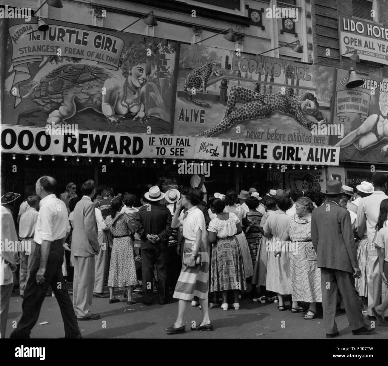 1962 - Coney Island: The freak shows get the crowds at Coney Island. The curiosity that marks us all is the key to the business and brings in the dollars. This show is featuring '' The Turtle Girl'', ''The Leopard Girl'' and the ''Sheep headed girl''. A thousand dollar reward is offered if they are not alive. Just try and collect it! © Keystone Pictures USA/ZUMAPRESS.com/Alamy Live News Stock Photo