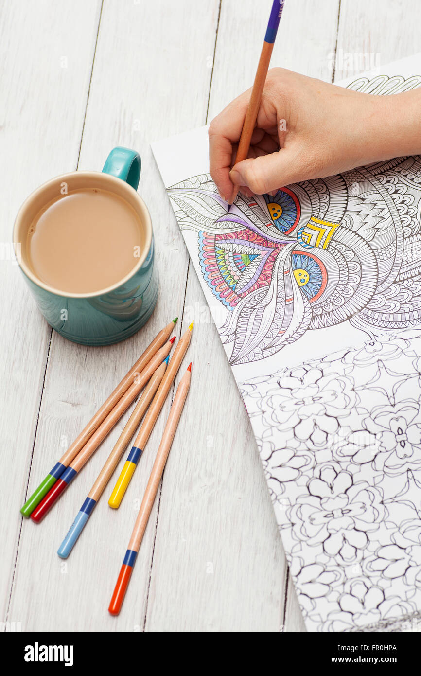 Many Adult Coloring Book Designs With Pencil Crayons Stock Photo