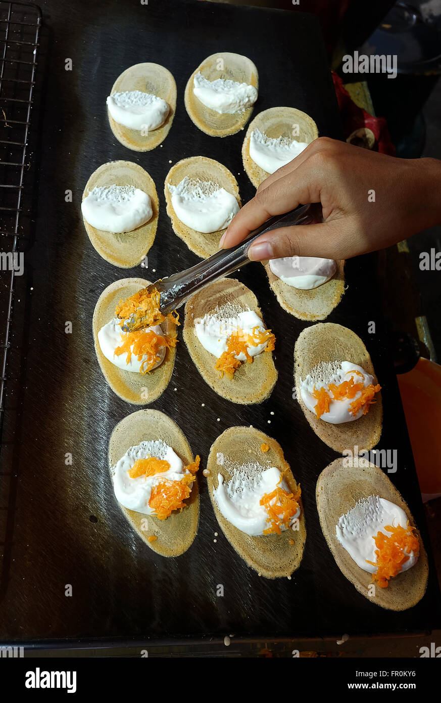 Khanom Beaung Thai or a kind of filled pancake Thai food or Thai Style Crisp Tart on tray, Thailand - (Selective focus) Stock Photo