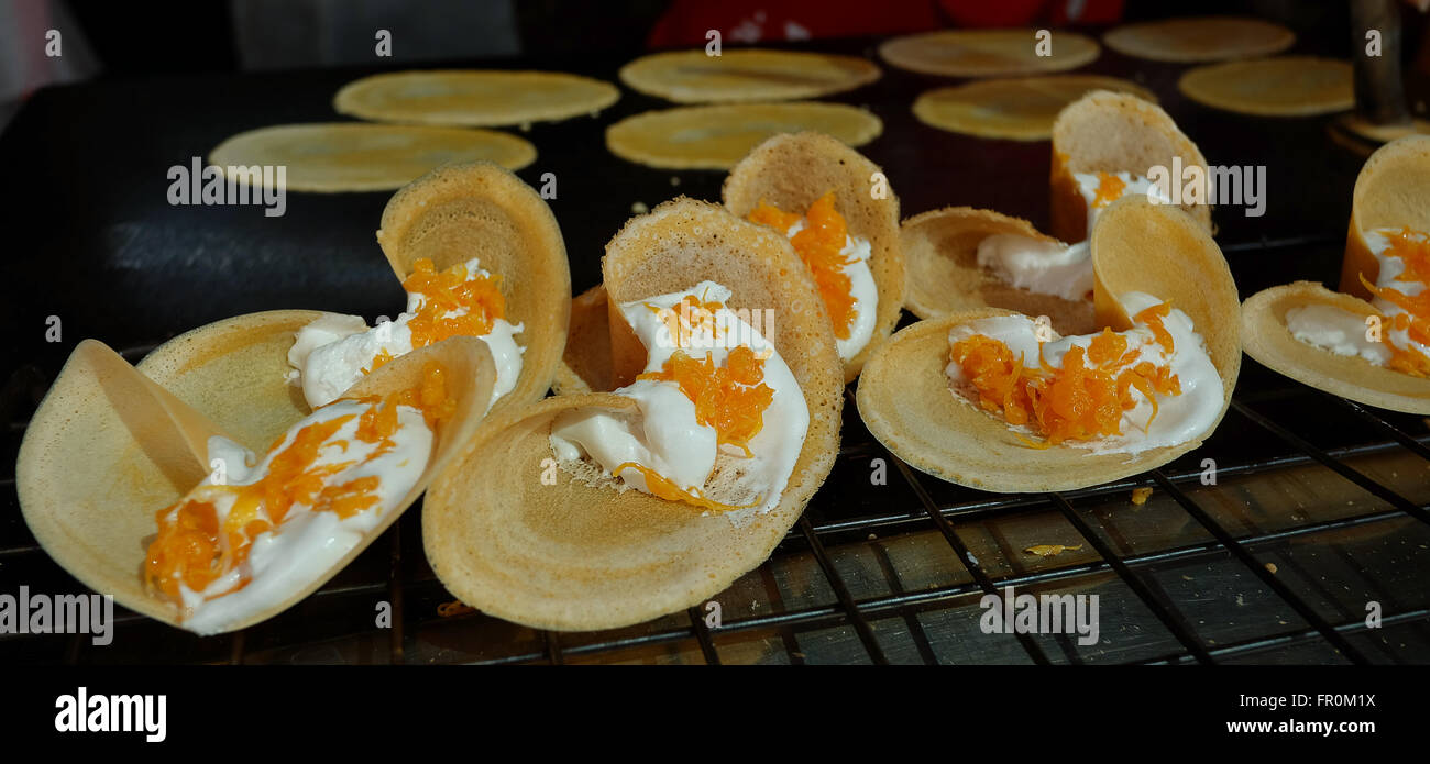 Khanom Beaung Thai or a kind of filled pancake Thai food or Thai Style Crisp Tart on tray, Thailand - (Selective focus) Stock Photo