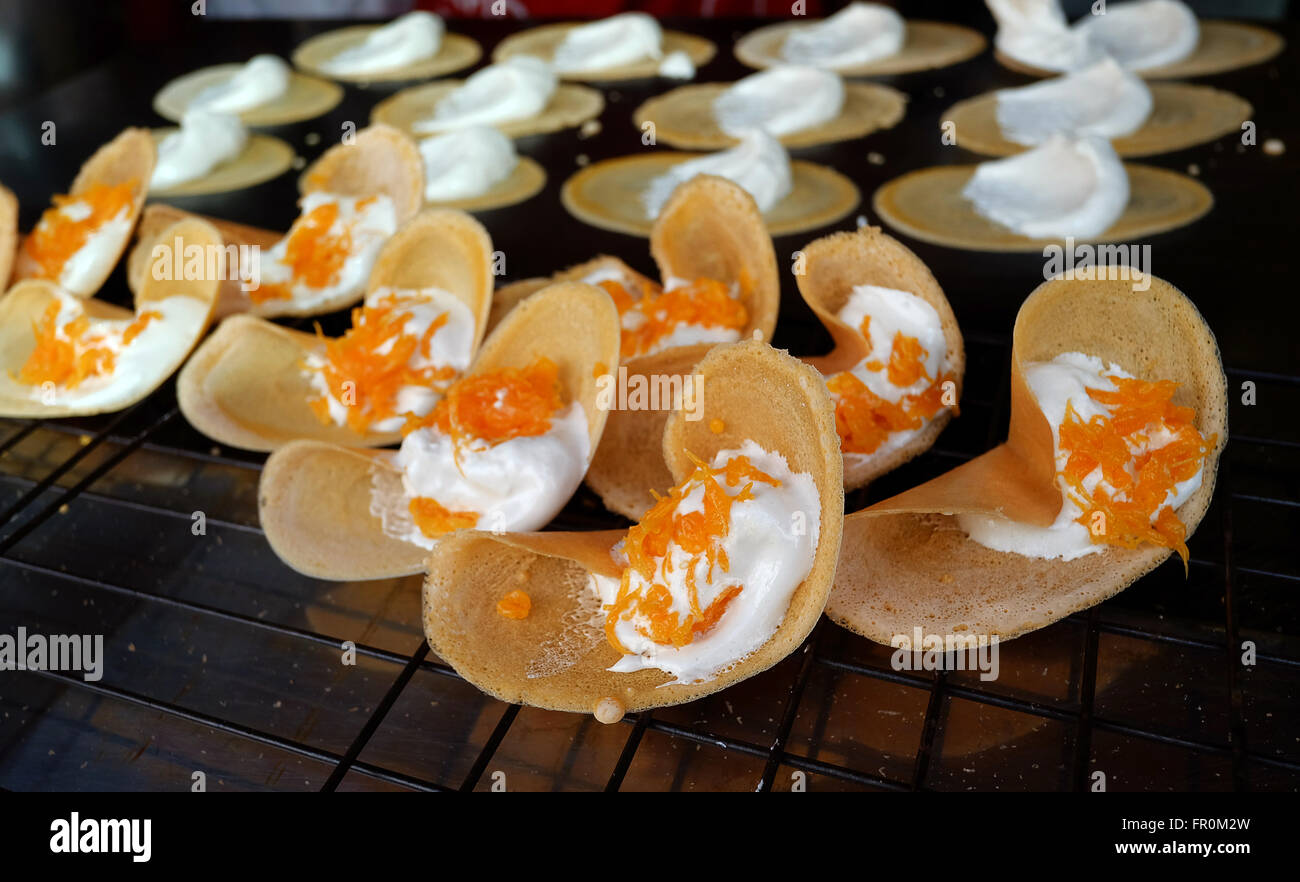 Khanom Beaung Thai or a kind of filled pancake Thai food or Thai Style Crisp Tart on tray, Thailand - (Selective focus) Stock Photo