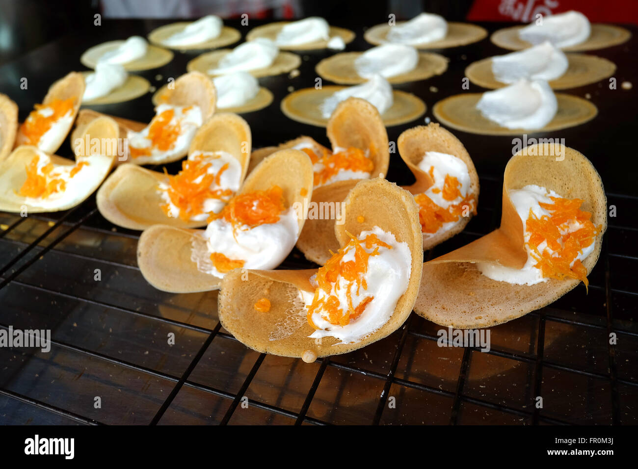 Khanom Beaung Thai or a kind of filled pancake Thai food or Thai Style Crisp Tart on tray, Thailand - (Selective focus) Stock Photo