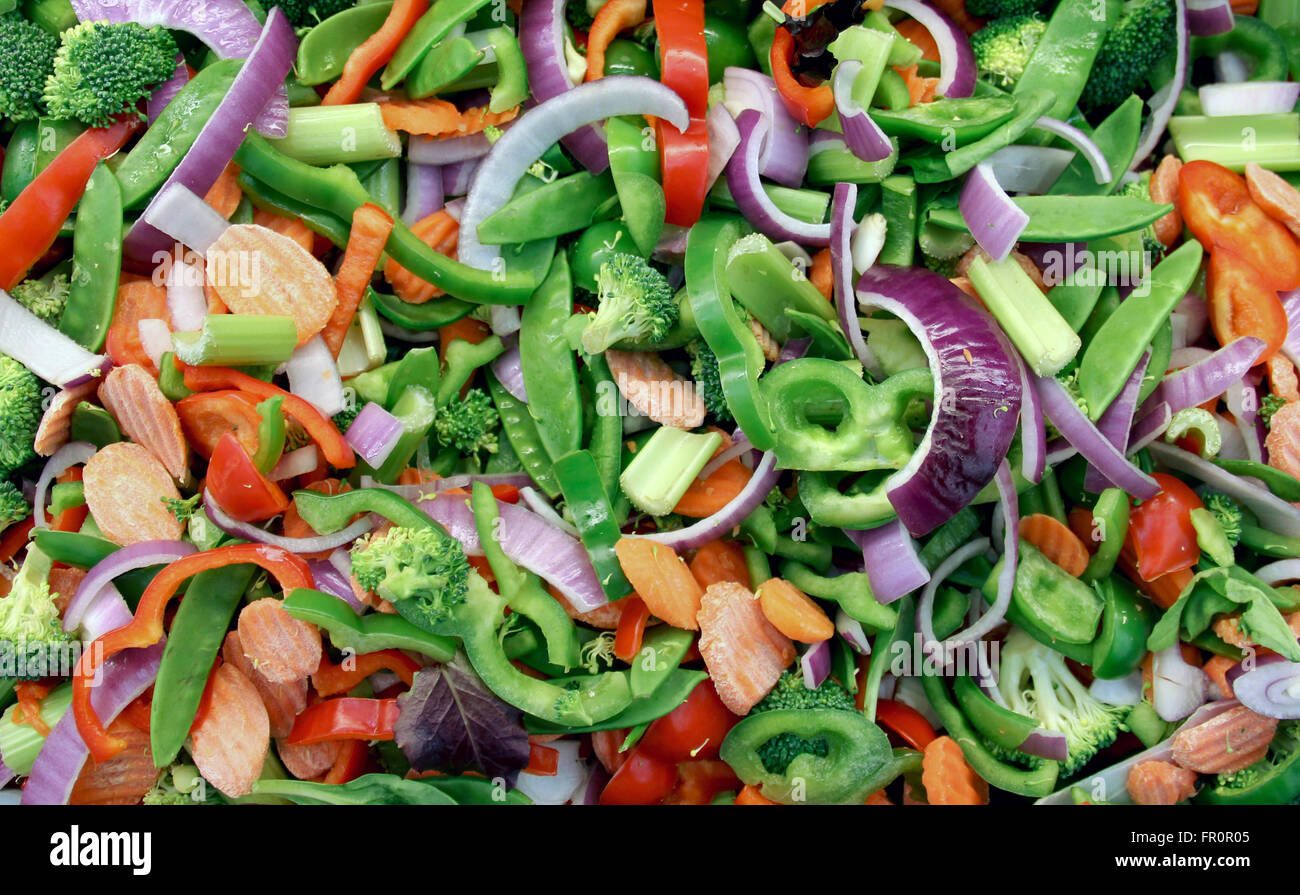 Fresh sliced and chopped vegetables make a healthy produce background Stock Photo