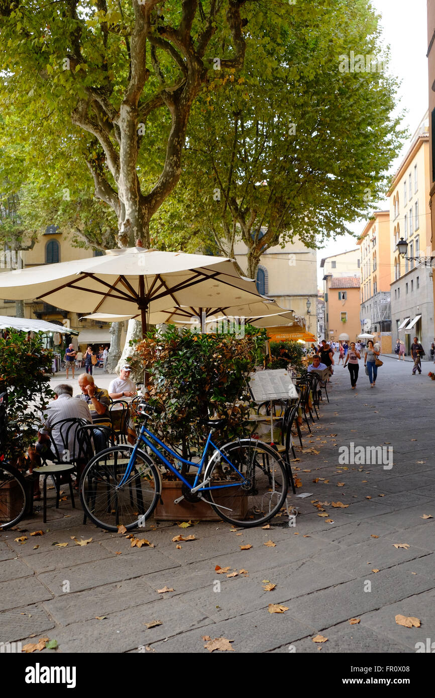 Bicycle parked outside pavement cafe, Lucca, Italy Stock Photo