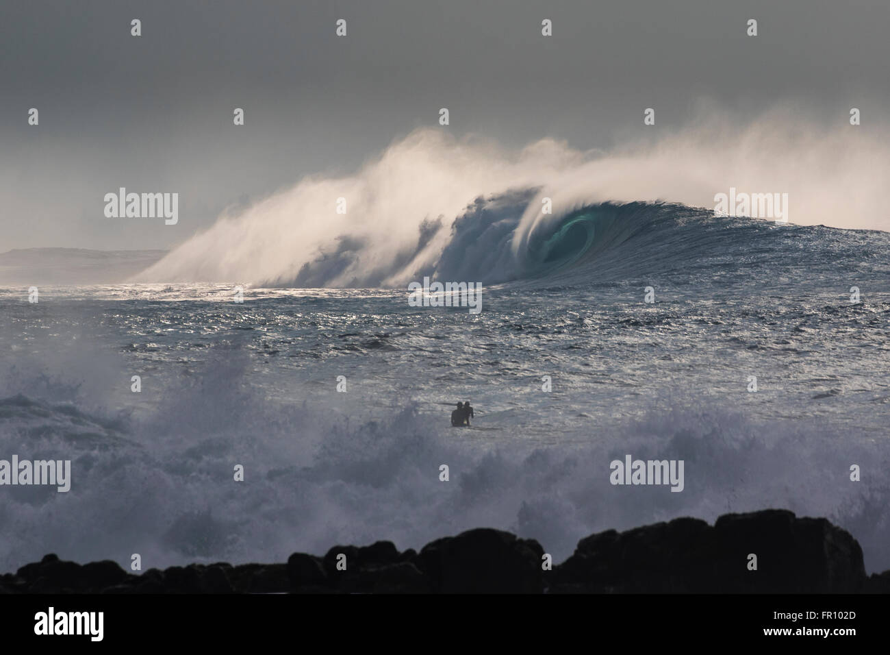 A view of a large wave across from Waimea bay during a large swell on