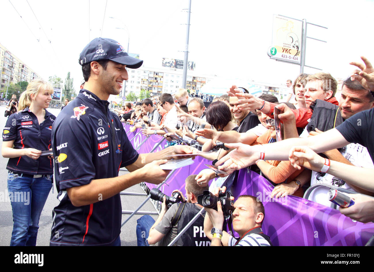 KYIV, UKRAINE - MAY 19, 2012: Formula 1 driver Daniel Ricciardo of Red Bull Racing Team signs autographs during Red Bull Champio Stock Photo