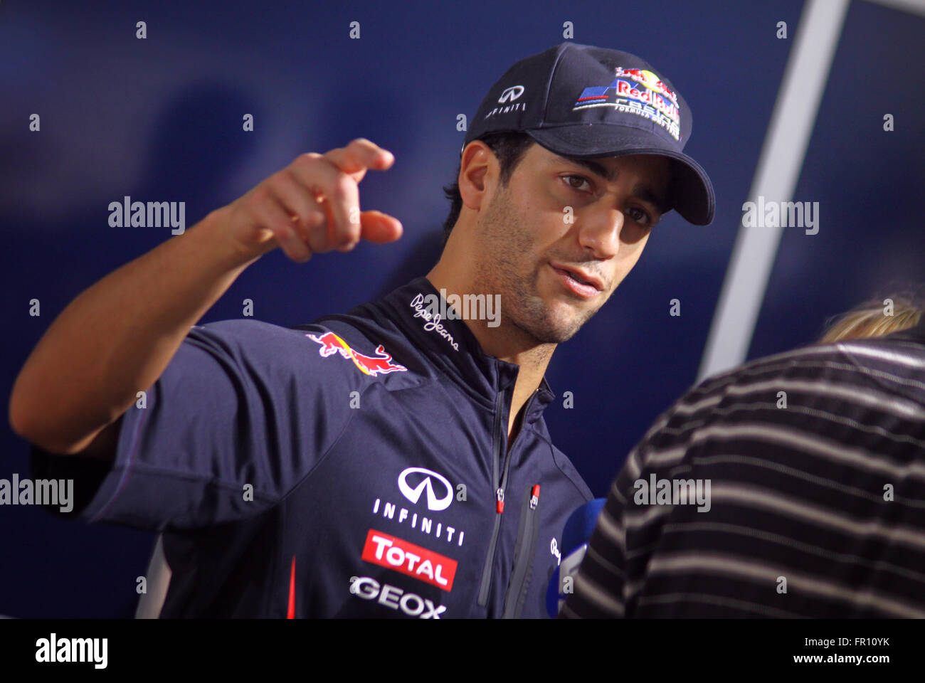 KYIV, UKRAINE - MAY 19, 2012: Driver Daniel Ricciardo of Red Bull Racing Team looks on during Red Bull Champions Parade on the streets of Kyiv city Stock Photo