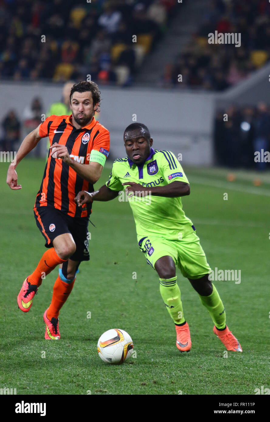 LVIV, UKRAINE - March 10, 2016: Darijo Srna of FC Shakhtar Donetsk (L) fights for a ball with Frank Acheampong of RSC Anderlecht Stock Photo
