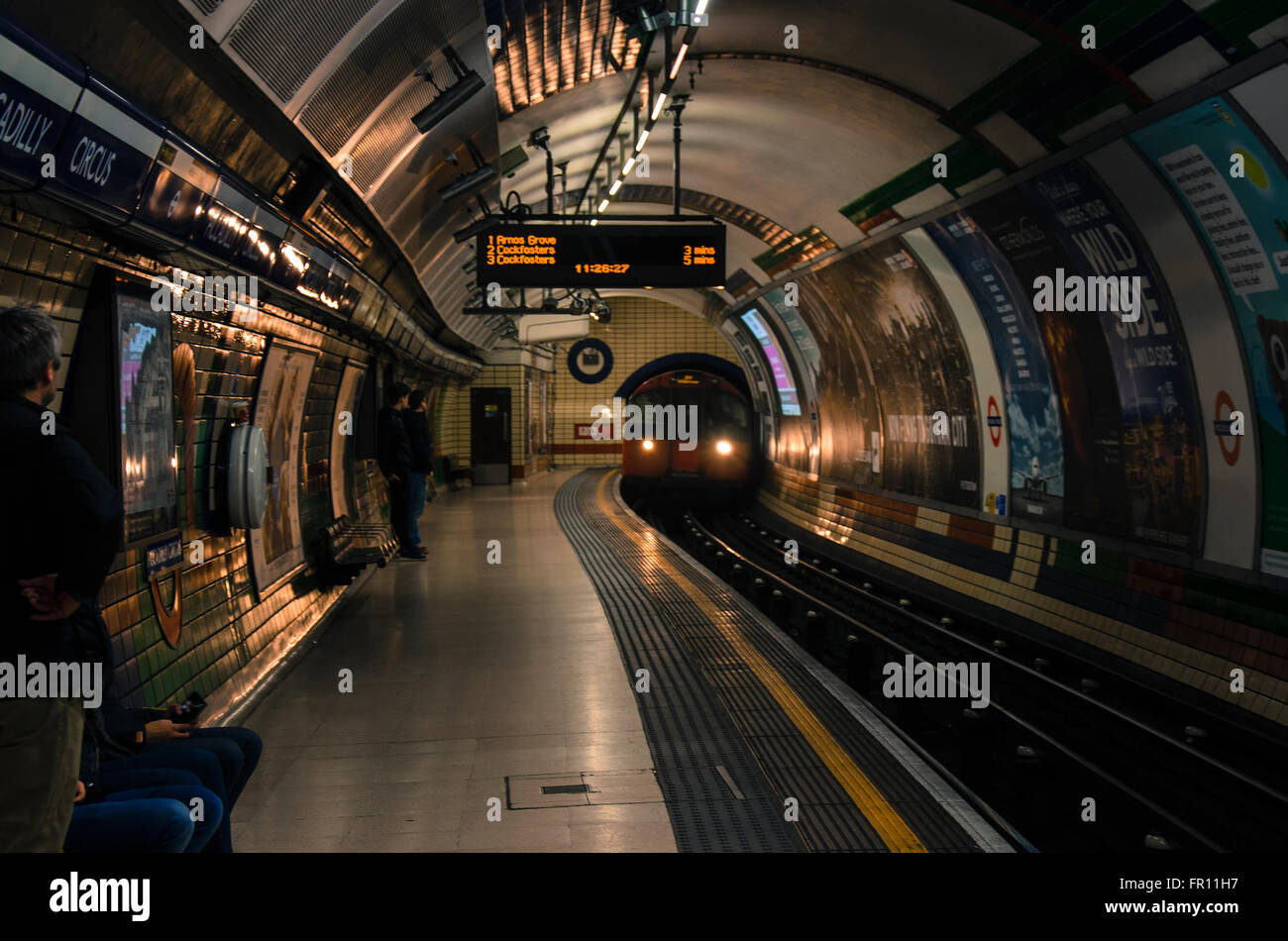A train arrives into Piccadilly Circus London Underground station on a