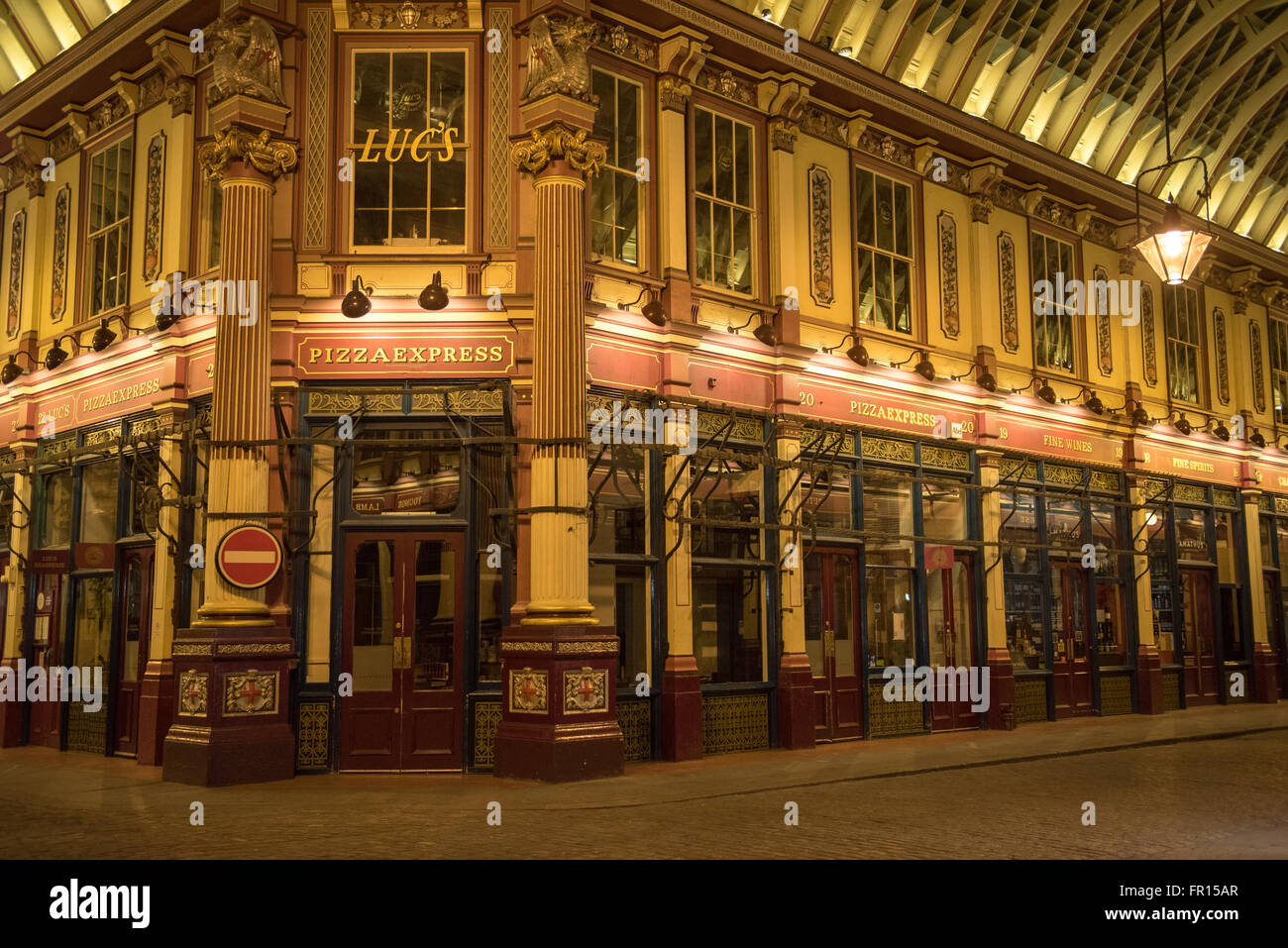 Leadenhall Market victorian cast iron shopping arcade at night in London Stock Photo