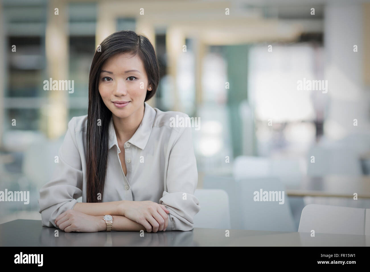 Asian businesswoman leaning on desk hi-res stock photography and images ...