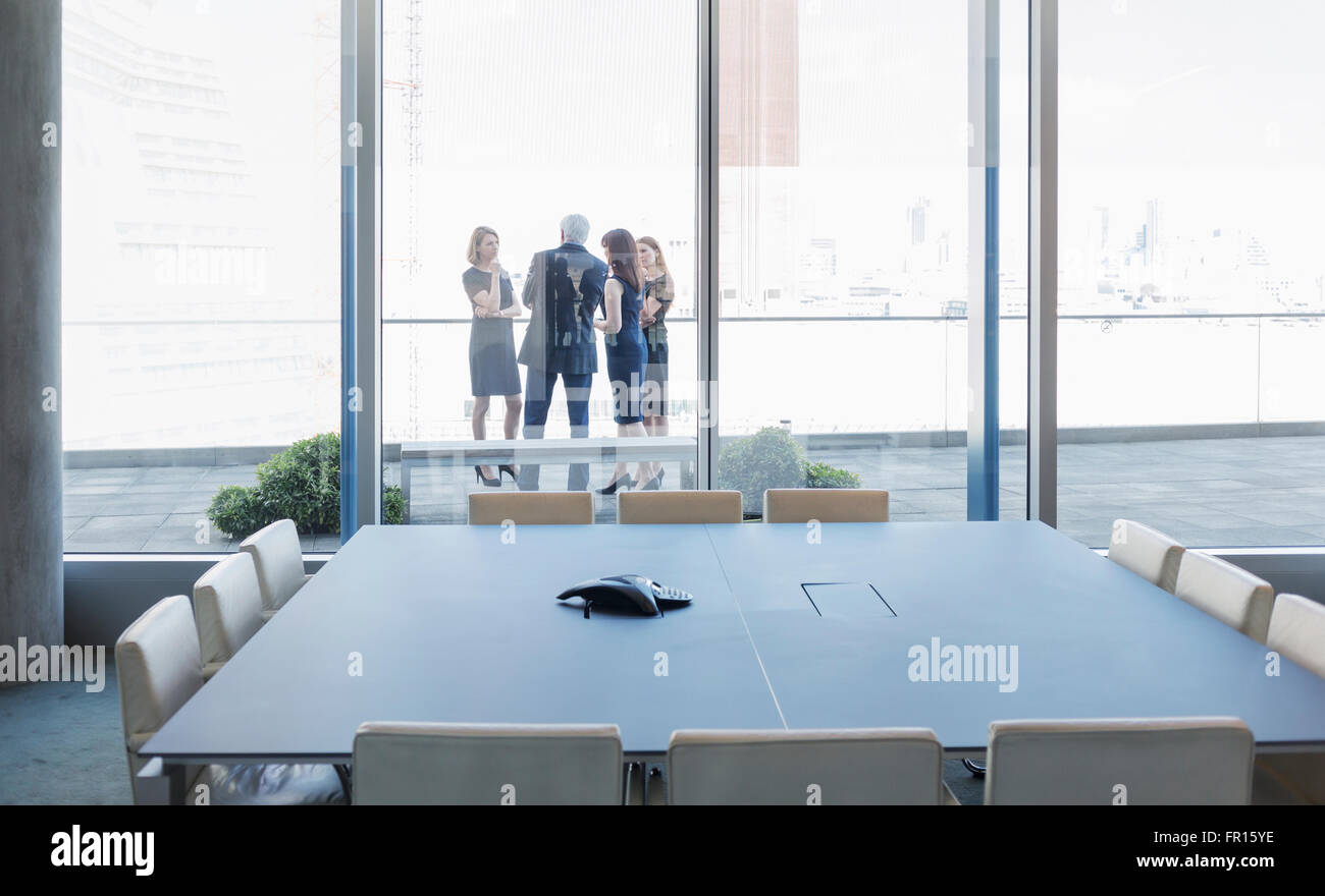 Business people talking on conference room balcony Stock Photo