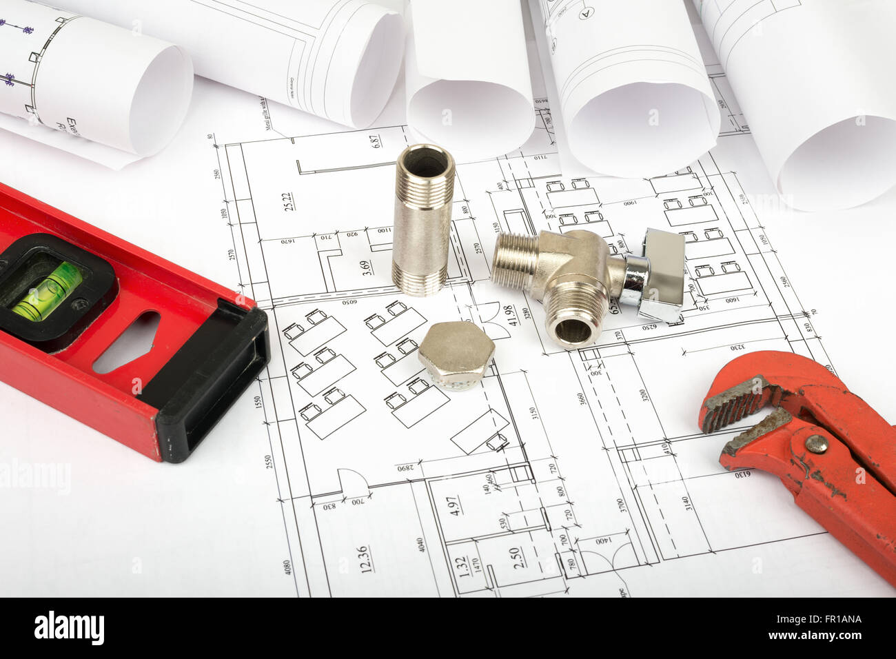 Screw Build Architecture plan and rolls of blueprints with turn-screw. Building ...