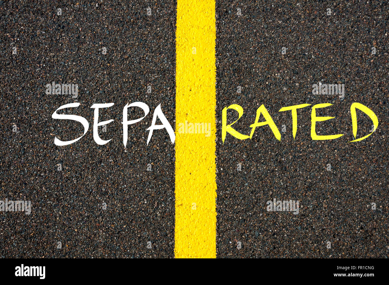 Road marking yellow paint dividing line between SEPA and RATED as word