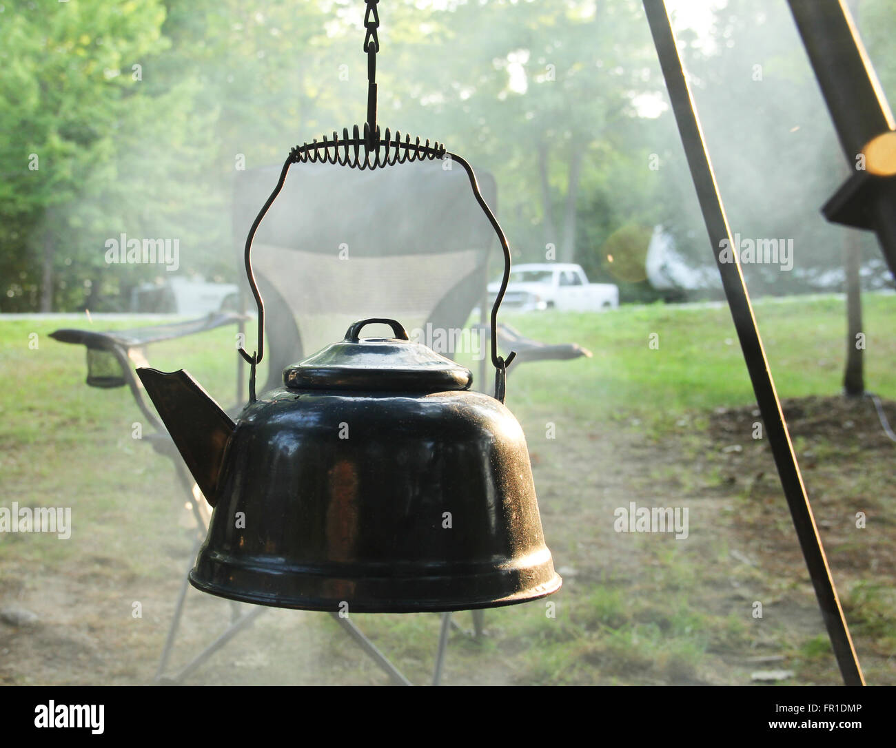 https://c8.alamy.com/comp/FR1DMP/teapot-heating-water-over-a-smoke-filled-campfire-FR1DMP.jpg