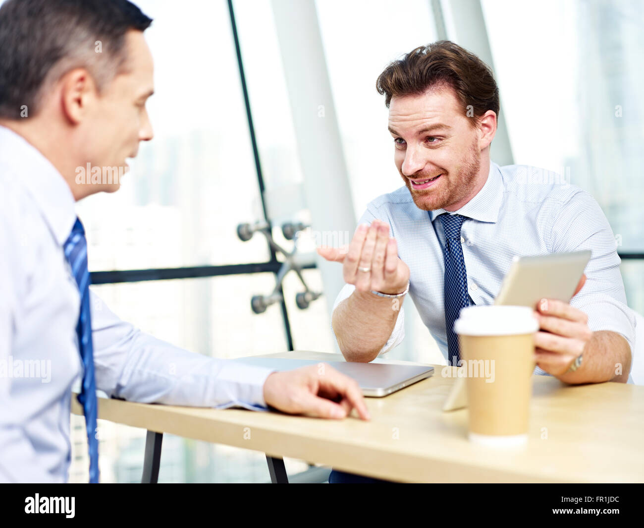 corporate people discussing business in office. Stock Photo