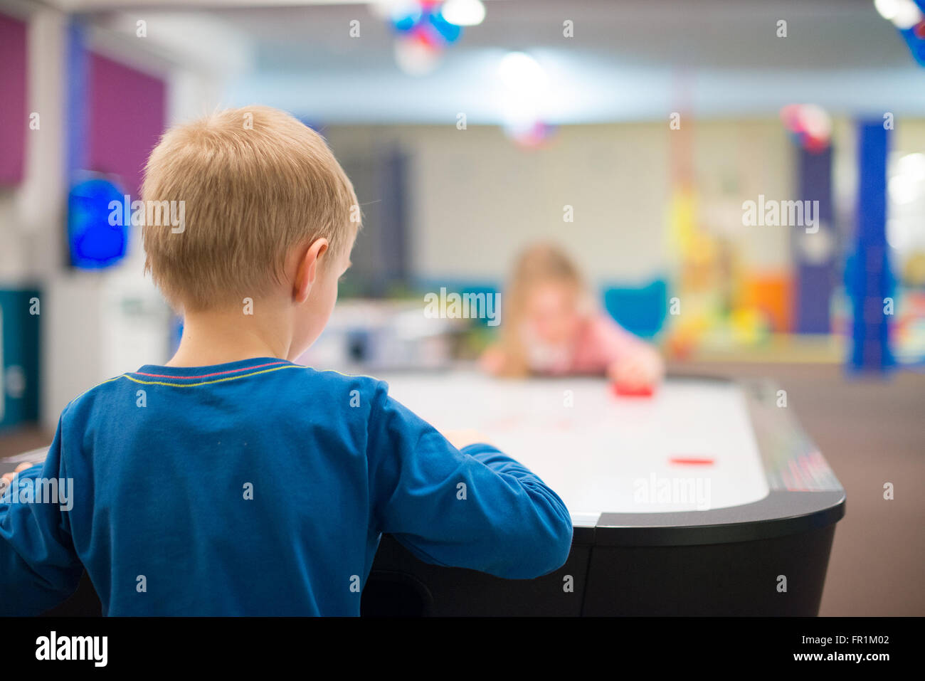 Children playing ice hockey table board game Stock Photo Alamy