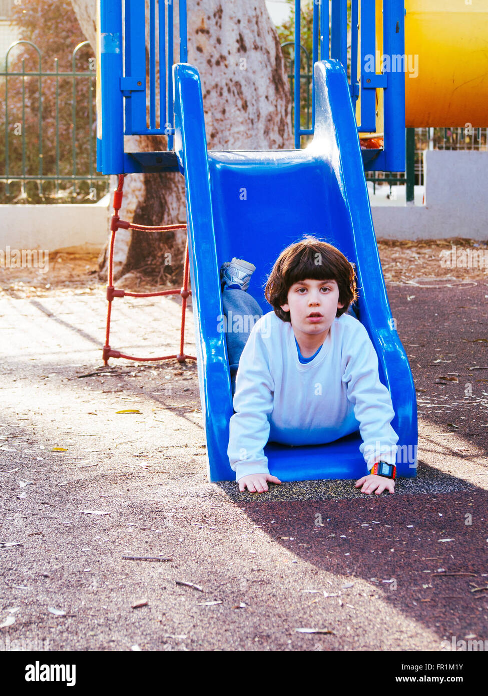 Boy playing outdoors hi-res stock photography and images - Alamy