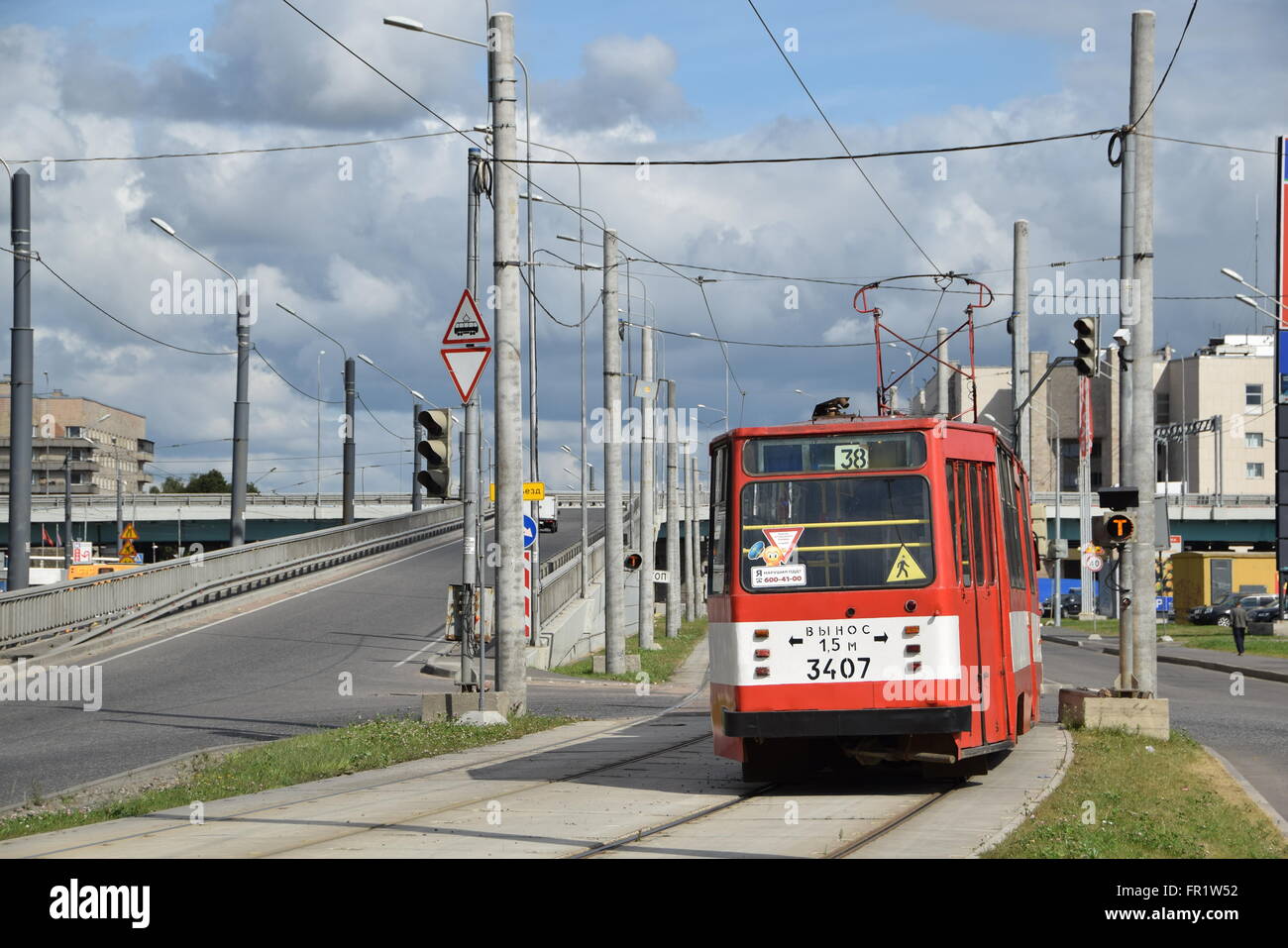 A tram car of service 38 enters the newly built segregation of Piskaryovsky Prospect in Saint Petersburg Stock Photo