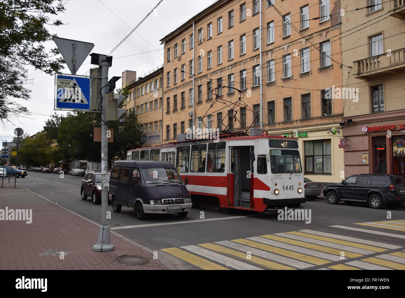 Old original LM-68M tram car servicing route 40 awaiting green signal at Smolyachkova Street Stock Photo