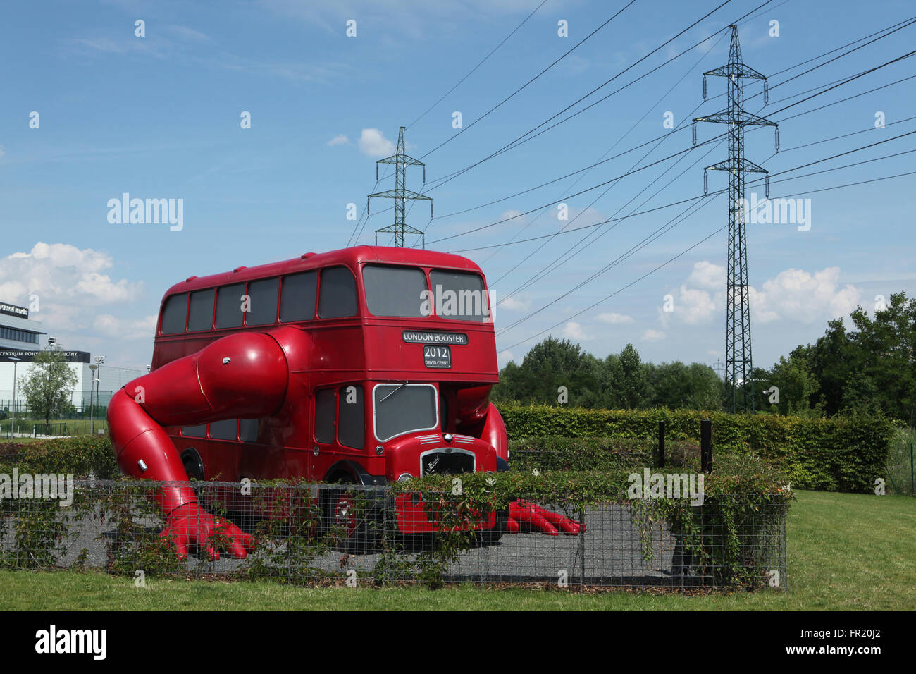 Art installation London Booster (2012) created by Czech visual artist David Cerny seen parked in Chodov district in Prague, Czech Republic. Famous art installation London Booster was created by David Cerny from a 1957 London double-decker bus for the 2012 Summer Olympics in London, UK. Stock Photo