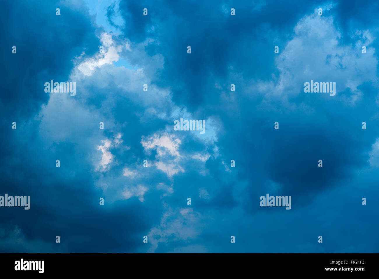 Dramatic clouds on blue sky after thunderstorm Stock Photo