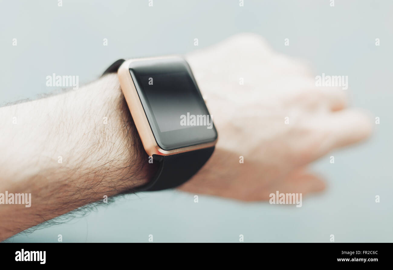 Male hand with stylish smart watch. Fashionable technology in real life usage. Focus on wrist watch Stock Photo Alamy