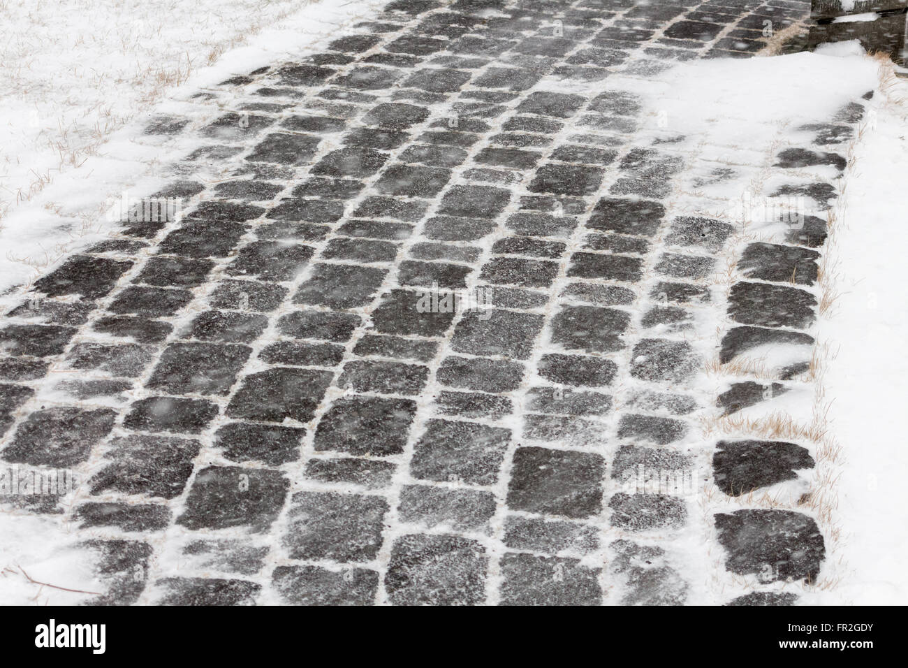 cobble stone covered in snow Stock Photo