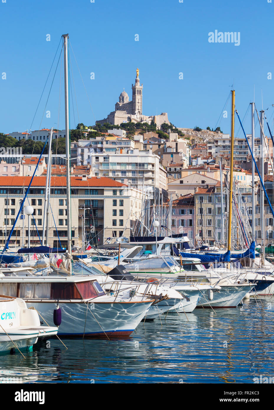 Marseille, Provence-Alpes-Côte d'Azur, France.  View across Vieux-Port, the Old Port, to the 19th century Neo-Byzantine Basilica Stock Photo