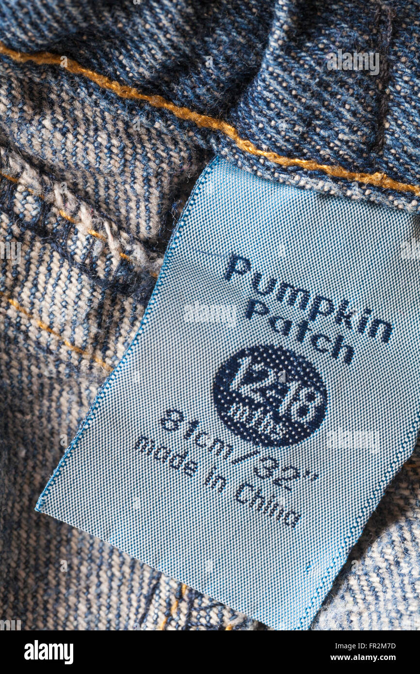label in Pumpkin Patch clothing baby's denim jeans for 12-18 mths made in China - sold in the UK United Kingdom, Great Britain Stock Photo