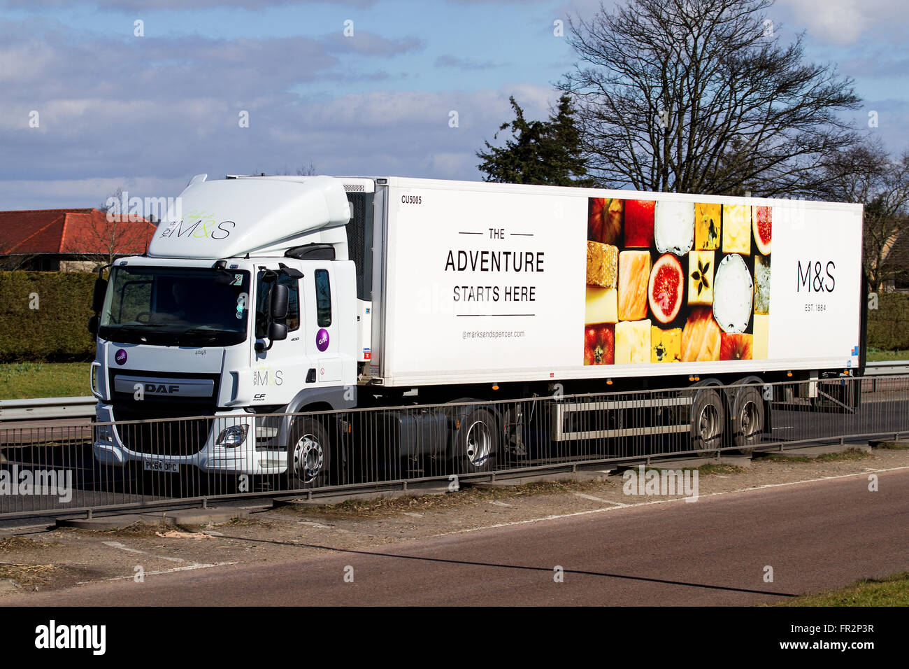 A Marks & Spencer articulated lorry travelling along the Kingsway West Dual Carriageway in Dundee, UK Stock Photo