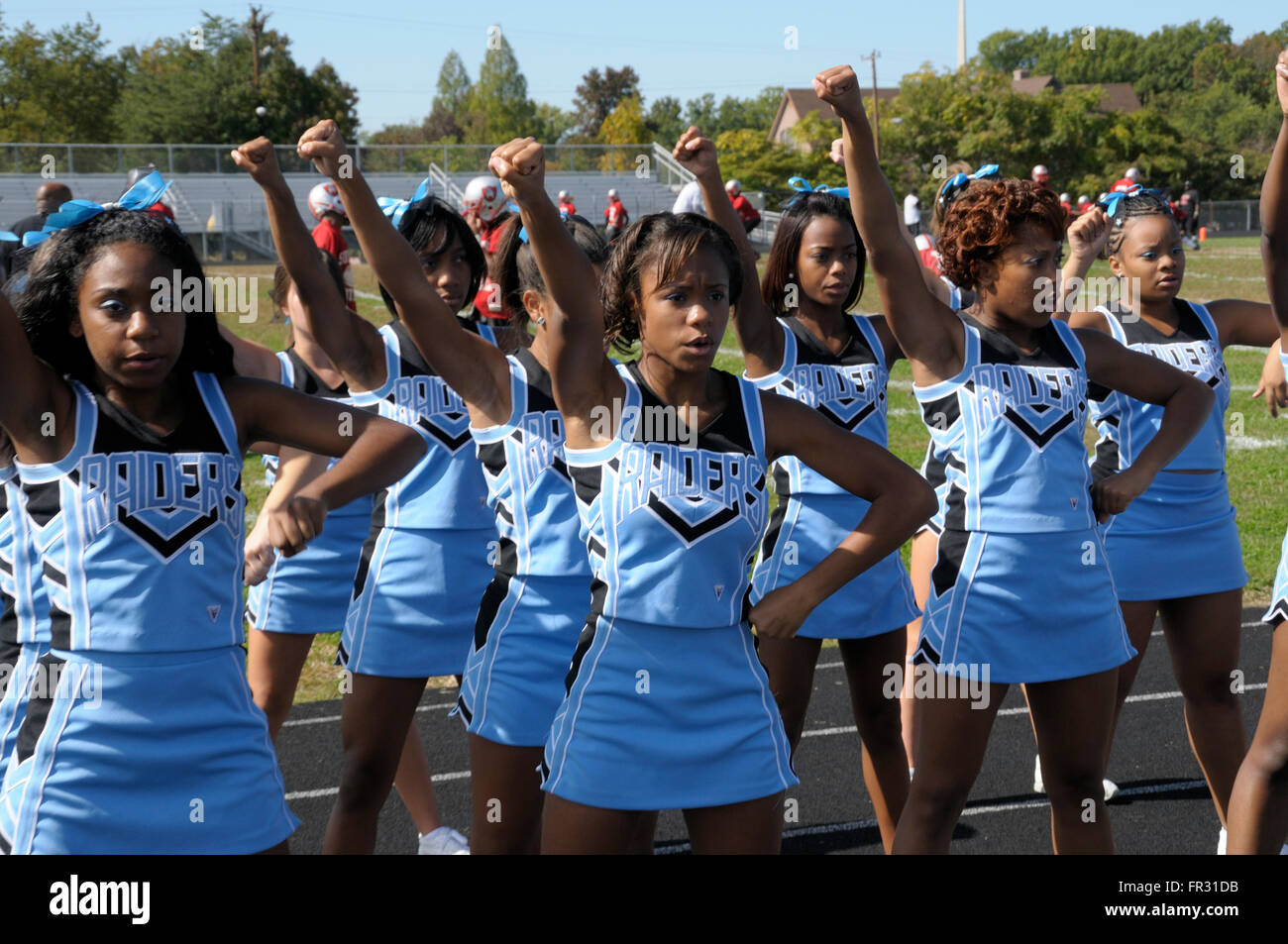 high school cheerleaders at a football game in Suitland, Maryland Stock Photo