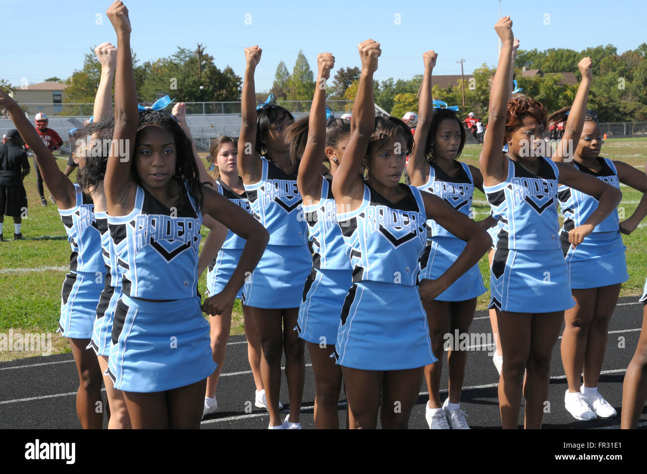 high school cheerleaders at a football game Stock Photo