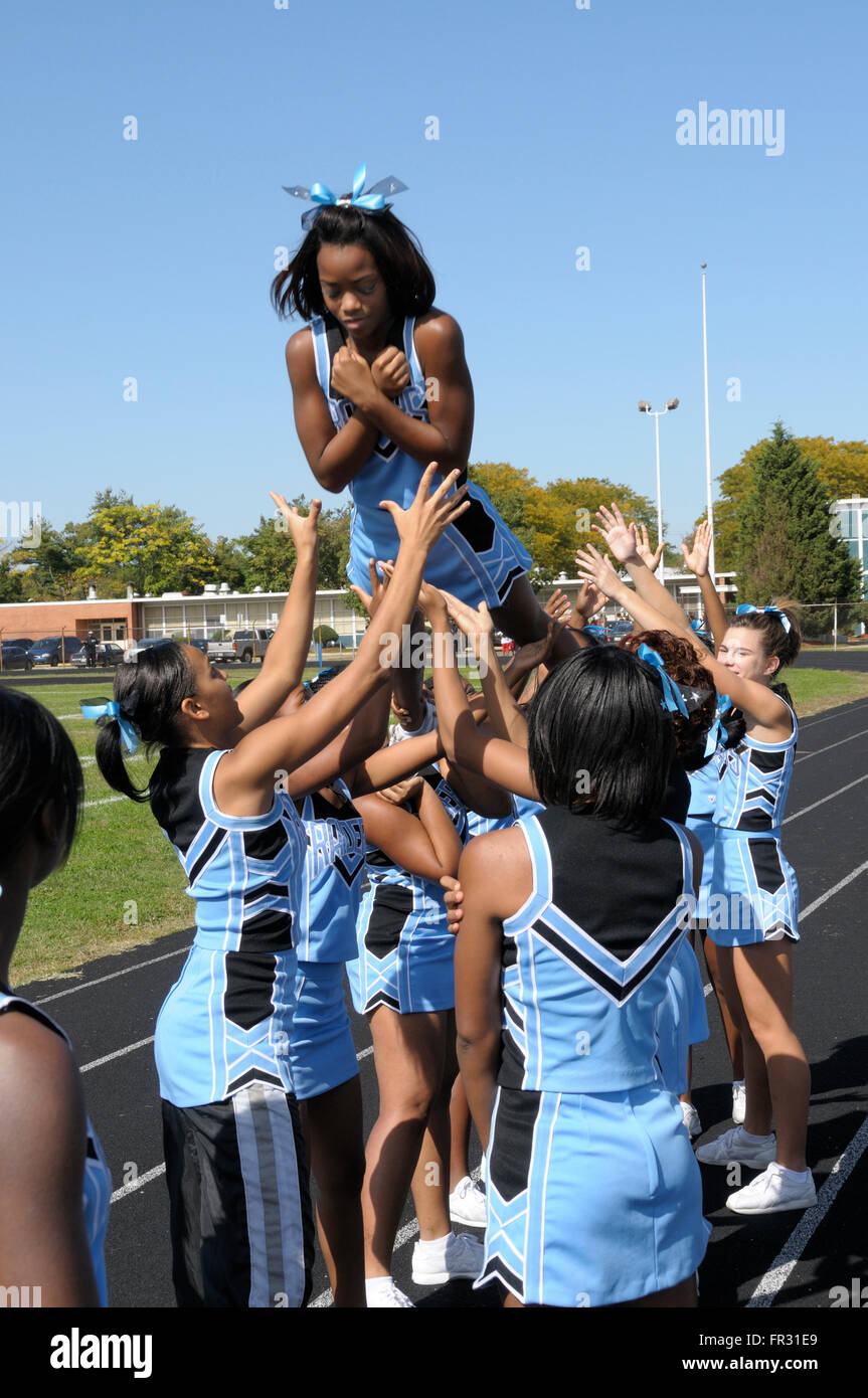 high school cheerleaders at a football game in Suitland, Maryland Stock Photo