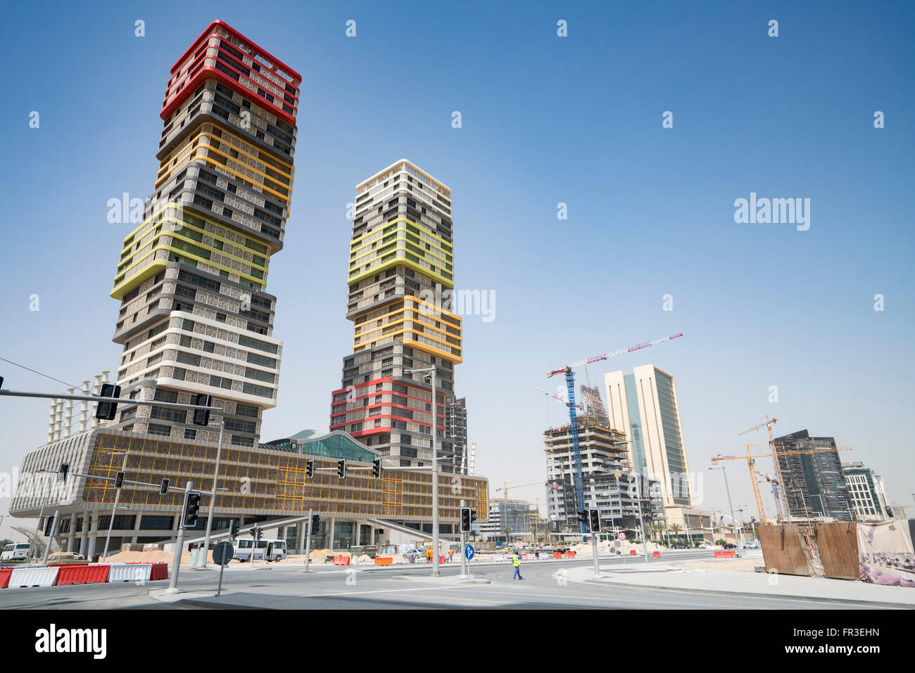 Twin Towers high-rise building under construction in Marina district in new Lusail City in Doha Qatar Stock Photo