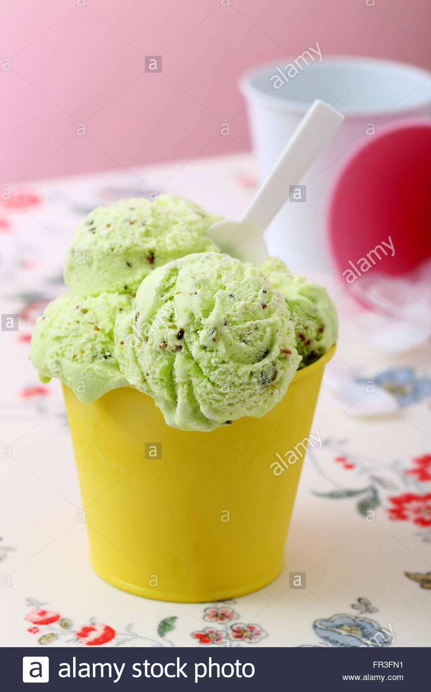 Download Color Full Ice Cream In Yellow Metal Cup Kitchen Table Background Stock Photo Alamy Yellowimages Mockups