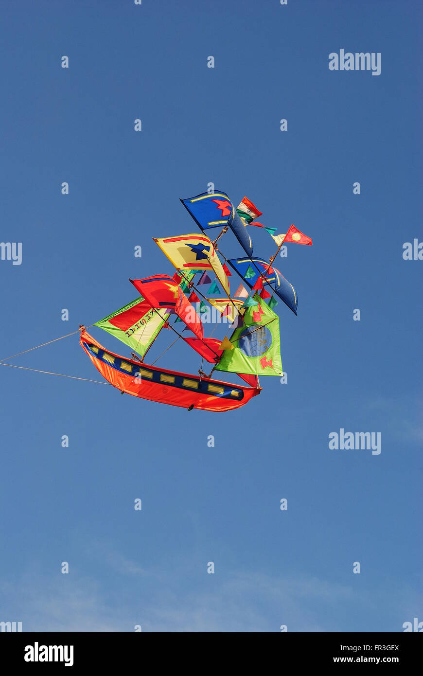 a bright and colourful ship shaped kite flying during the Kite Flying
