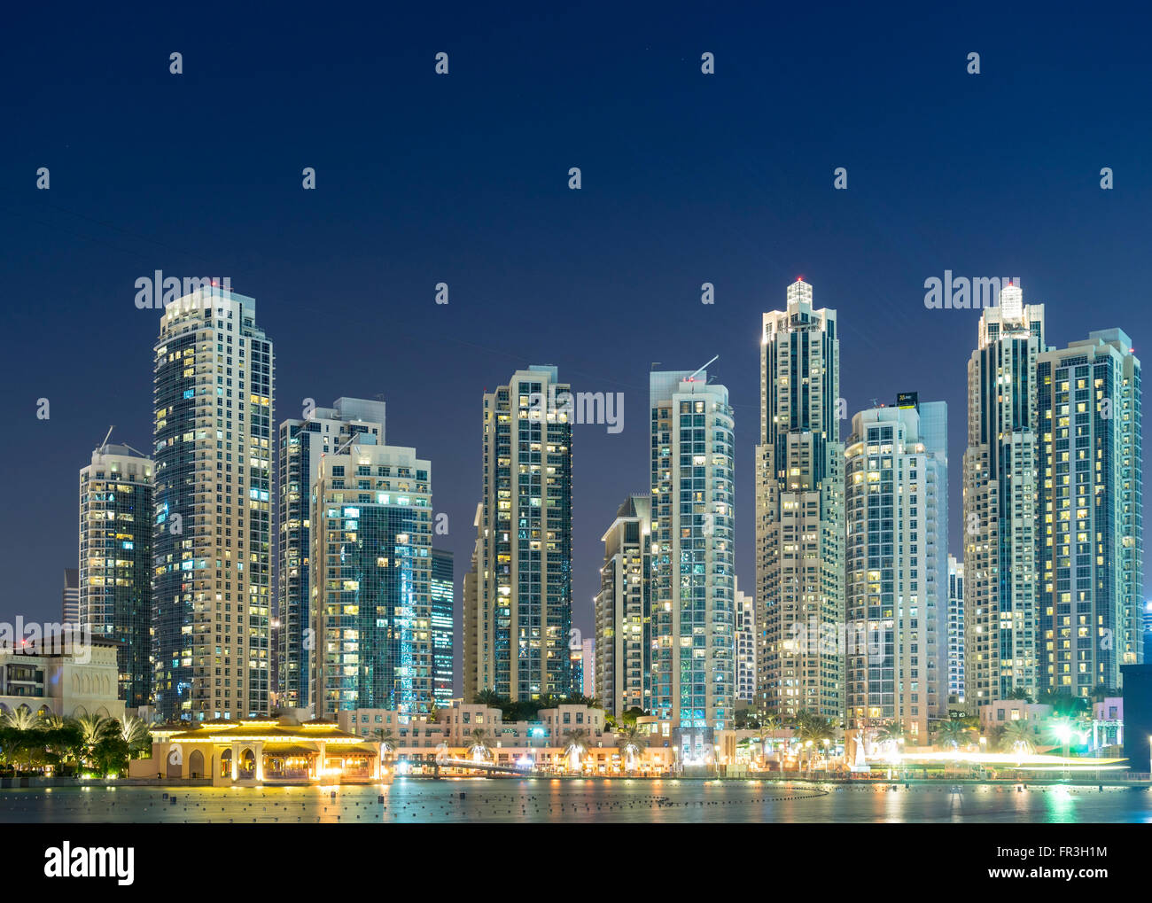 Night view of many high-rise luxury apartment towers in Downtown Dubai United Arab Emirates Stock Photo