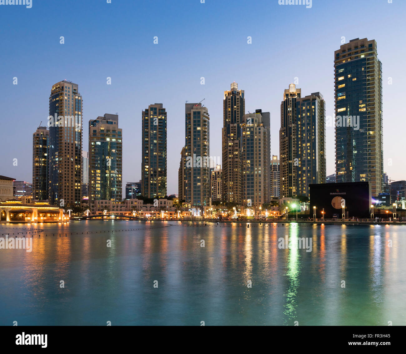 Night view of many high-rise luxury apartment towers in Downtown Dubai United Arab Emirates Stock Photo